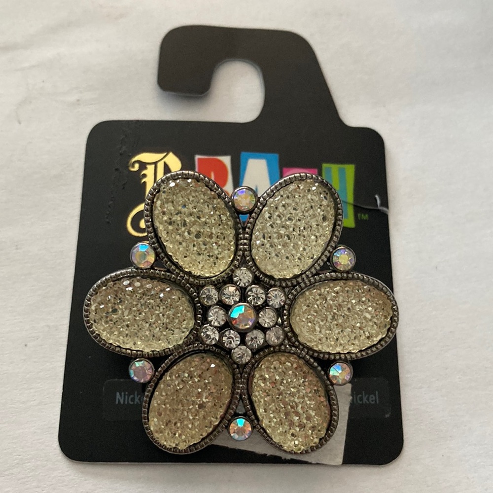 Free with purchase. Adjustable flower ring
